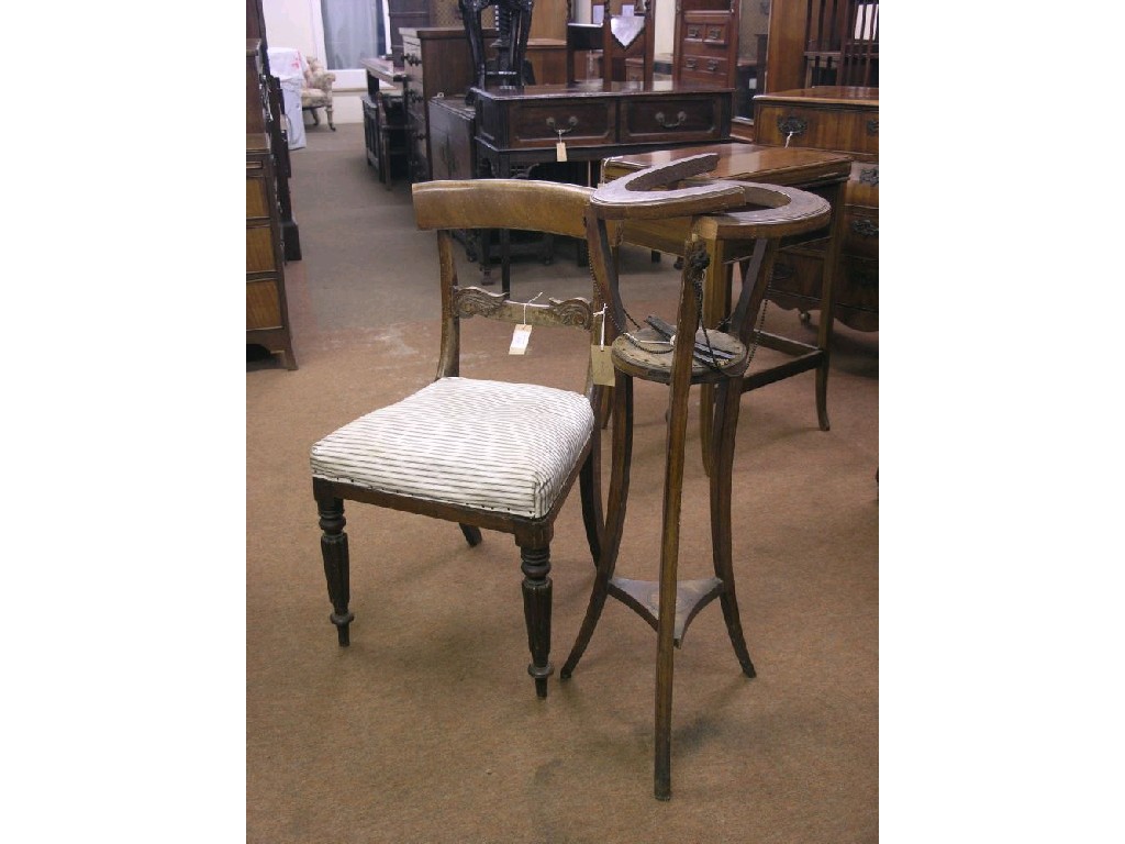 Appraisal: An Edwardian inlaid mahogany jardiniere stand on three incurved mahogany