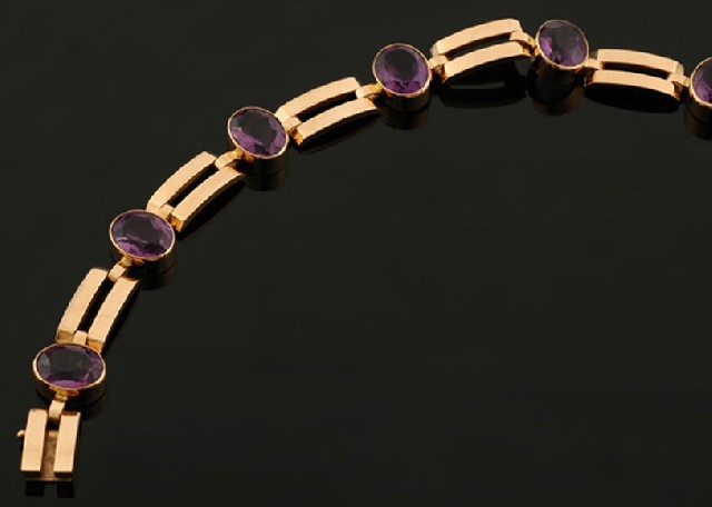 Appraisal: An amethyst cocktail bracelet Comprising six oval cut amethysts interspaced