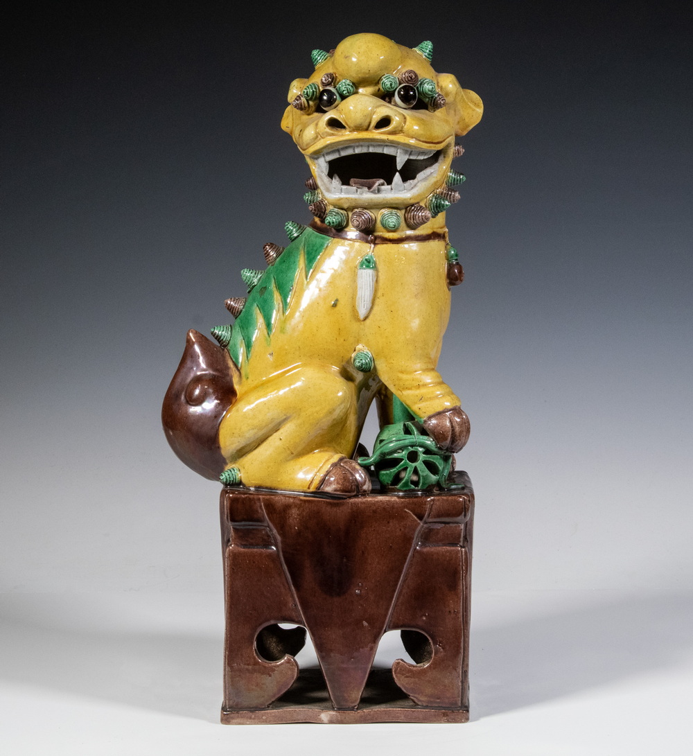 Appraisal: CHINESE PORCELAIN FOO DOG th c Sancai Glazed Seated Guardian