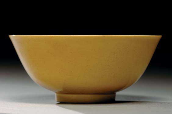 Appraisal: ANTIQUE YELLOW MONOCHROME BOWL th Century Chinese yellow monochrome glazed