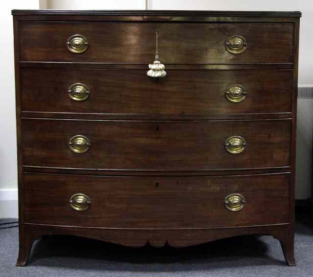 Appraisal: A th Century bowfronted chest of four long graduating drawers