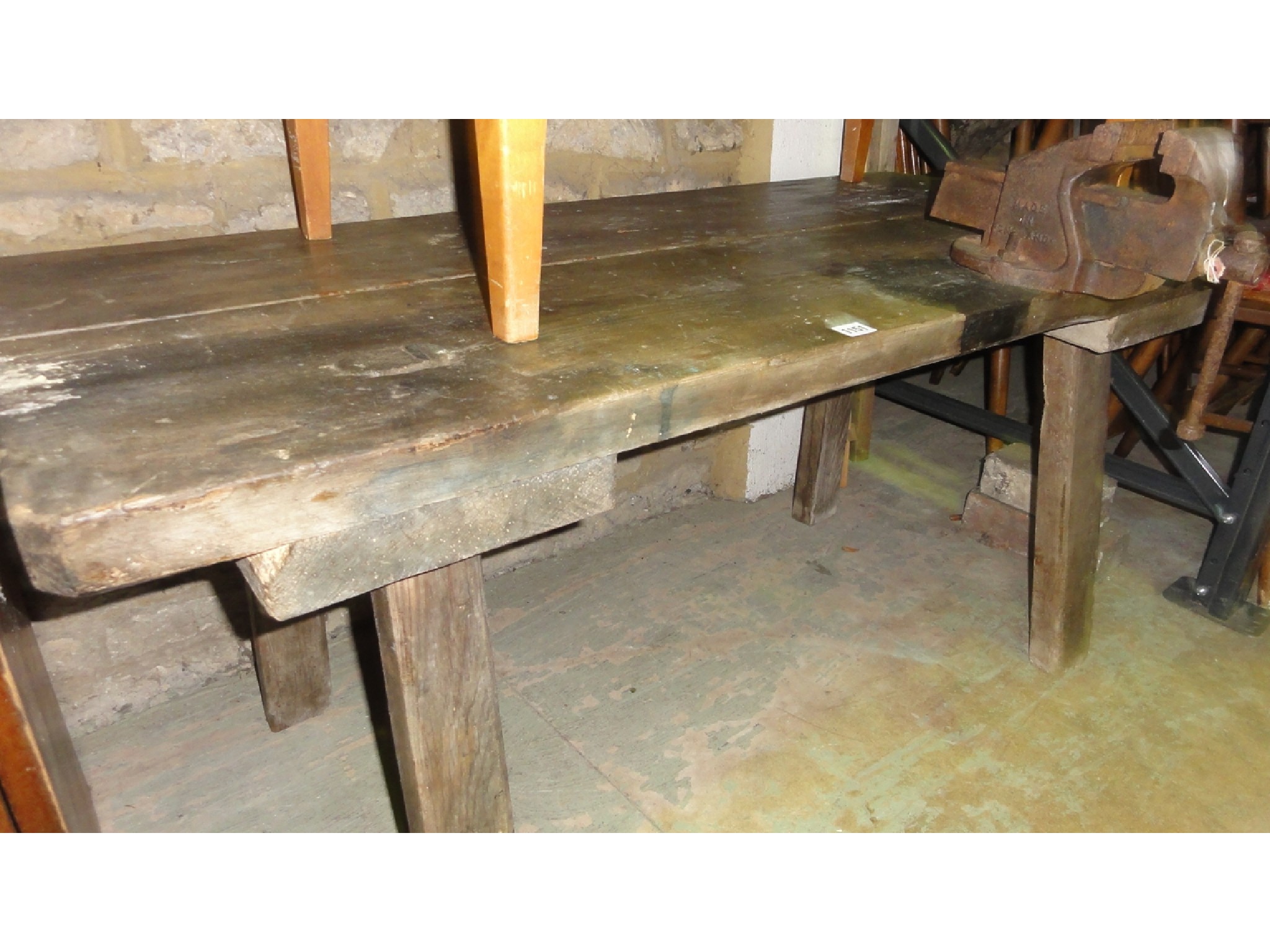 Appraisal: An antique rustic pine pig bench with through jointed legs