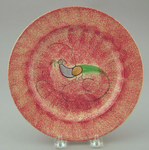 Appraisal: Red spatter plate th c with peafowl dia