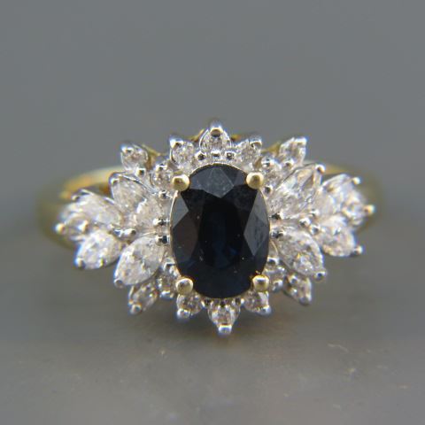 Appraisal: Sapphire Diamond Ring blue oval sapphire weighing carat surrounded by