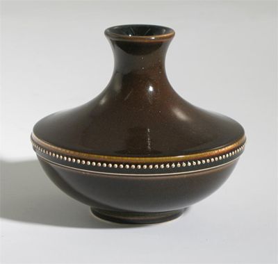 Appraisal: A Wedgwood earthenware vase by Norman Wilson compressed form with