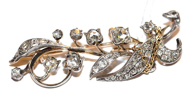 Appraisal: A VICTORIAN DIAMOND SET FLORAL BROOCH in the form of