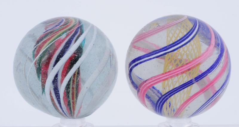 Appraisal: Lot Of Large Swirl Marbles Lot includes one yellow latticino