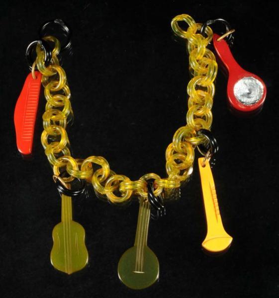 Appraisal: Bakelite Bracelet with Instruments Description Bracelet with five instruments Condition