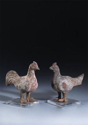 Appraisal: A pair of Chinese unglazed pottery models of chickens Tang