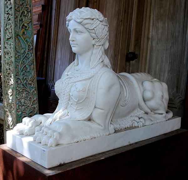 Appraisal: A PAIR OF CONTEMPORARY MARBLE ARCHITECTURAL STATUES OF SPHINXES iron