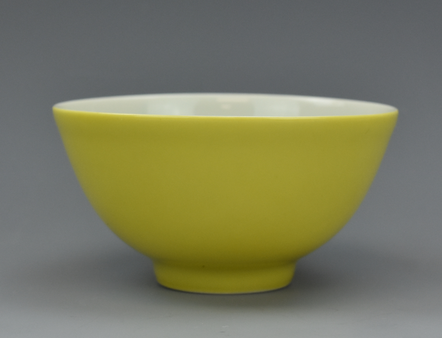 Appraisal: SMALL CHINESE YELLOW GLAZED CUP W QIANLONG MARK A simple