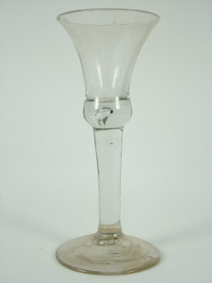 Appraisal: th century wine glass with plain tapering stem the base