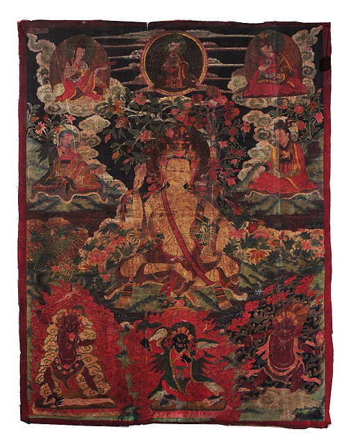 Appraisal: A large Tibetan Thankadepicting a seated Buddha surrounded by deities