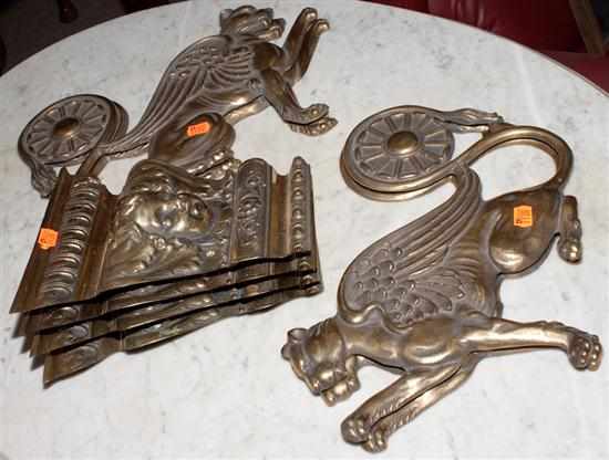 Appraisal: Four continental brass griffin mounts together with four cast brass