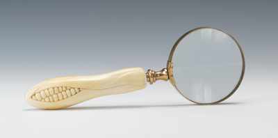 Appraisal: A Magnifying Glass with Carved Ivory Handle With brass surrounding