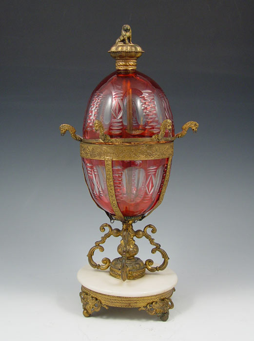 Appraisal: RUSSIAN CRANBERRY CUT TO CLEAR GLASS EGG Marble brass base