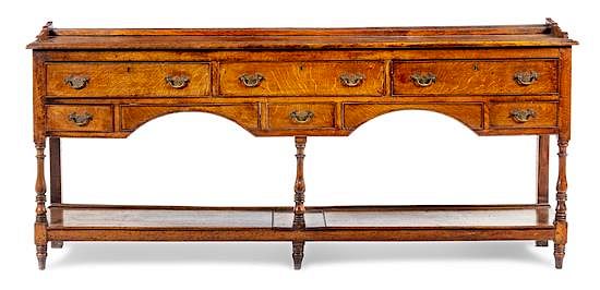 Appraisal: A George III Provincial Oak Sideboard Height x width x