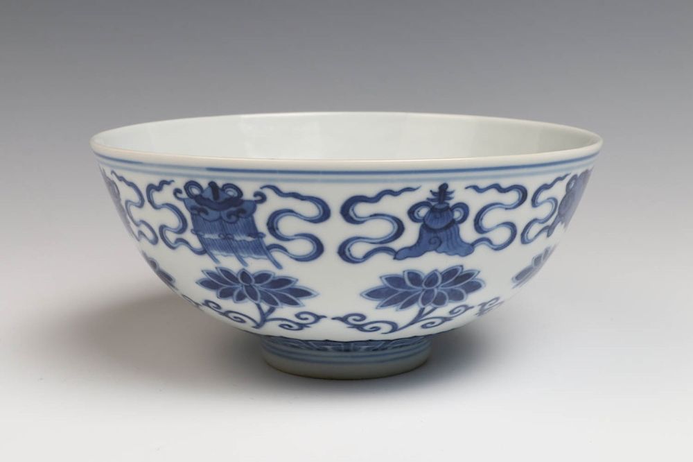 Appraisal: BLUE AND WHITE BUDDHIST EMBLEM BOWL GUANGXU The bowl decorated