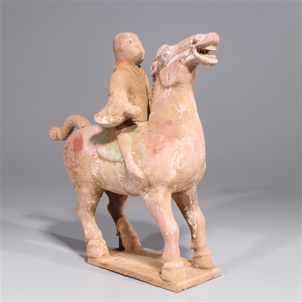 Appraisal: Early style Chinese pottery horse and rider the rider and