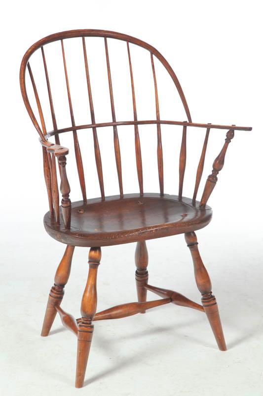 Appraisal: SACK-BACK WINDSOR ARMCHAIR American late th-early th century mixed woods