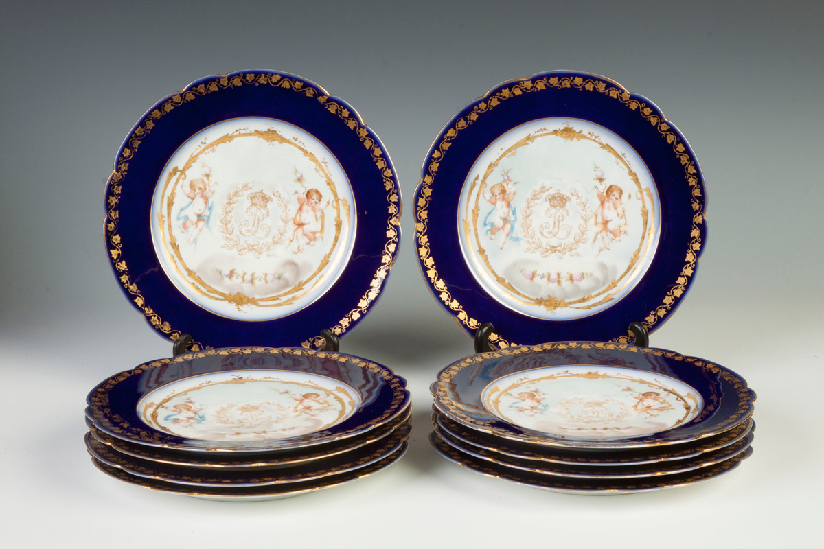 Appraisal: Sevres Set of Plates w Cherubs Gold Leafed Design