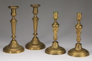 Appraisal: Neoclassical style gilt candleholders Two pairs of gilt brass candleholders