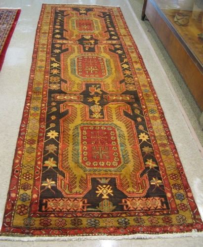 Appraisal: PERSIAN ARDEBIL RUNNER the black field decorated with three large