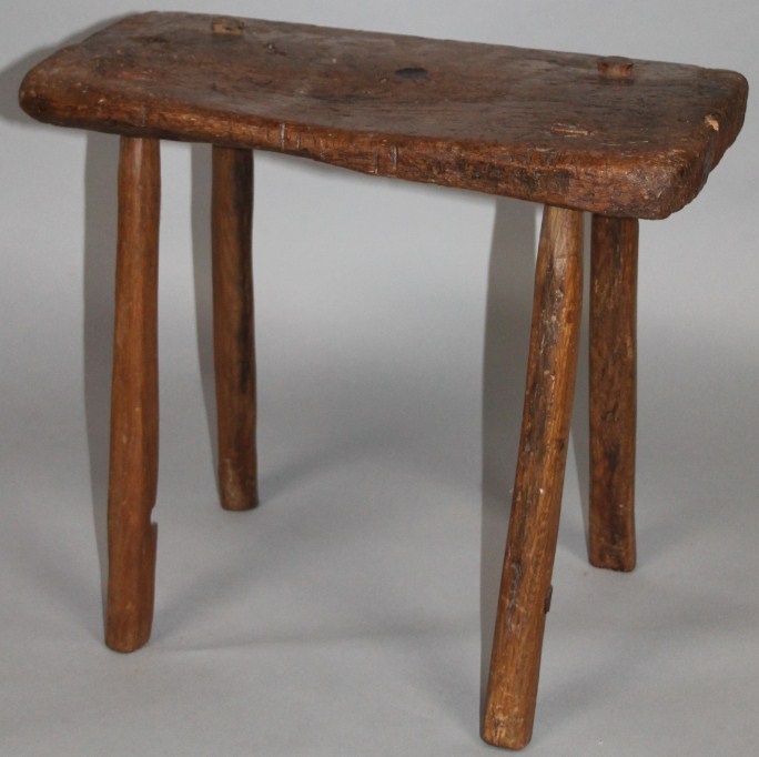 Appraisal: A thC rustic elm stool the rectangular top on four