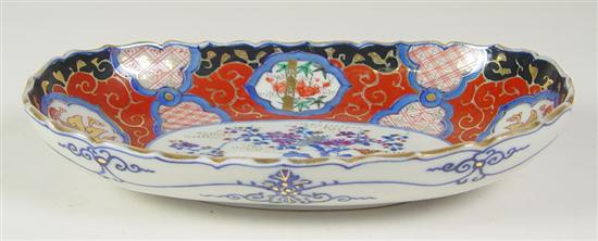 Appraisal: Japanese Imari Oval Bowl Beautiful central medallion floral Blue underglaze