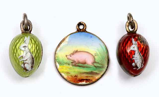 Appraisal: A SILVER AND ENAMEL EASTER EGG CHARM painted with a