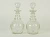 Appraisal: DECANTERS - Pair of clear cut glass decanters with a