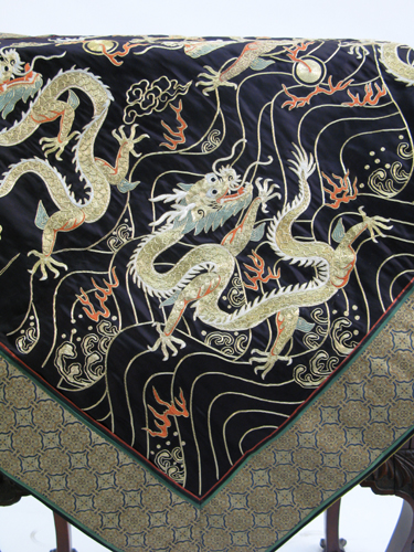 Appraisal: AN ASIAN HAND EMBROIDERED WALL HANGING the black silk ground