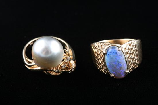 Appraisal: TWO K YELLOW GOLD AND GEMSTONE RINGS One has oval