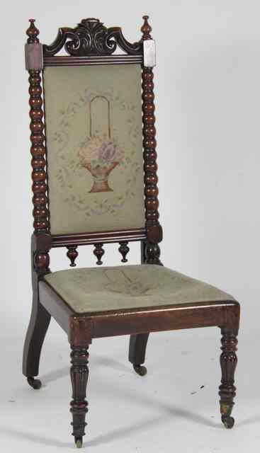 Appraisal: A Victorian walnut high back chair with carved frame