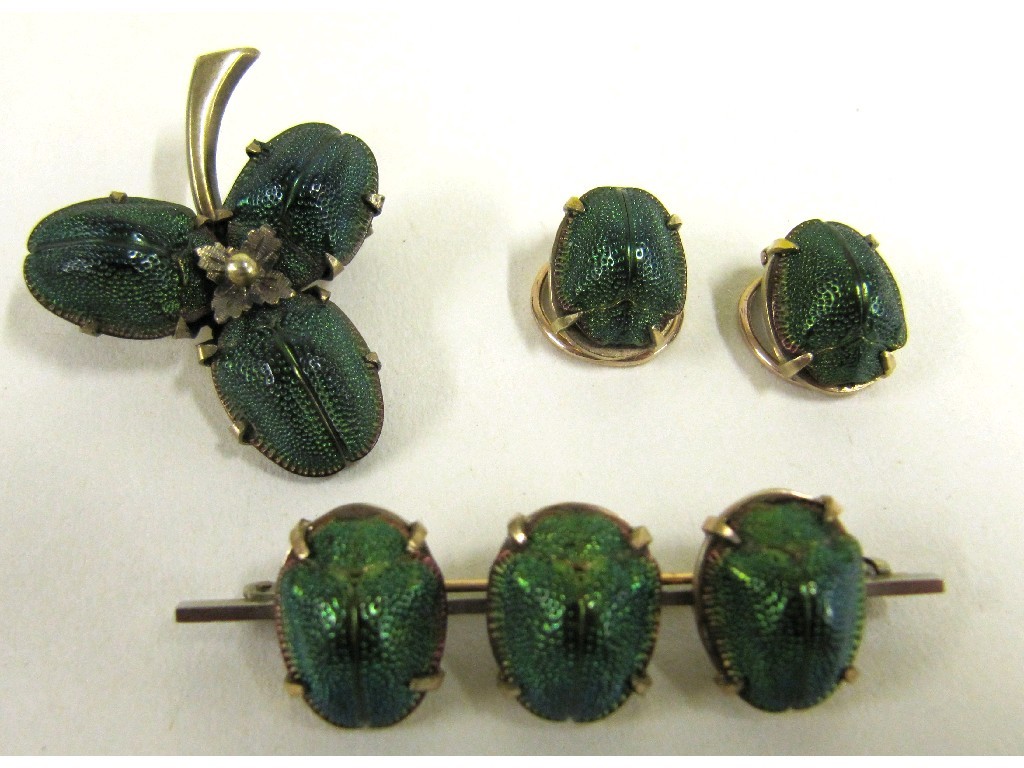 Appraisal: Scarab beetle set comprising bar brooch shamrock brooch and a