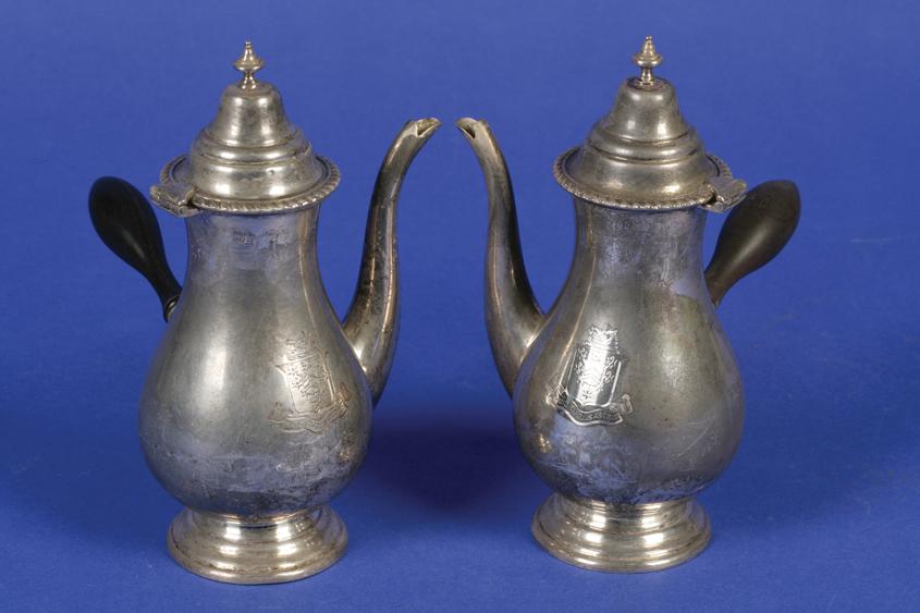 Appraisal: A PAIR OF CHOCOLATE POTS of baluster form with domed