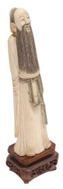 Appraisal: Chinese carved sage figure depicting a bearded man with hands