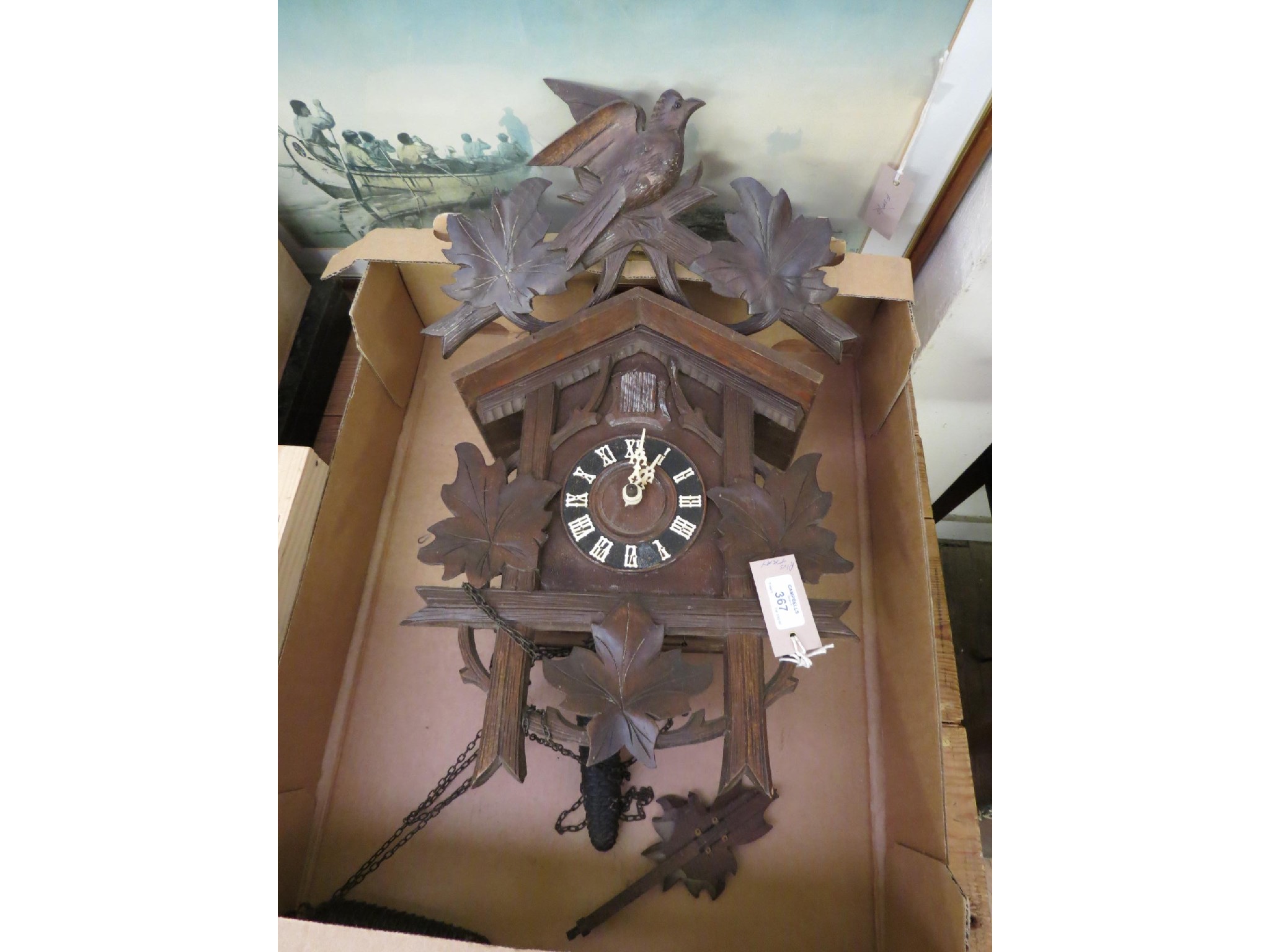 Appraisal: A Black Forest cuckoo clock with carved leaf and bird