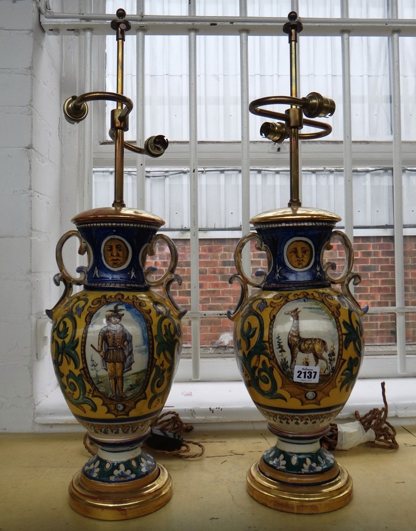 Appraisal: A pair of French faience two handled vase lamp bases