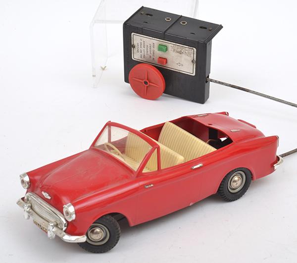 Appraisal: VICTORY MODELS HILLMAN MINX PUSH BUTTON REMOTE CONTROL CAR RED