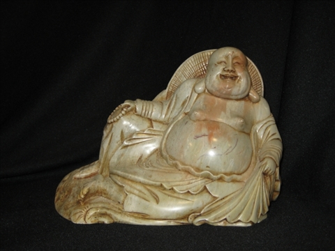 Appraisal: CHINESE SOAPSTONE FIGURE OF A SMILING BUDDHA The smiling deity