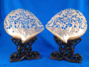 Appraisal: A pair of abalone shells carved and pierced with Chinese