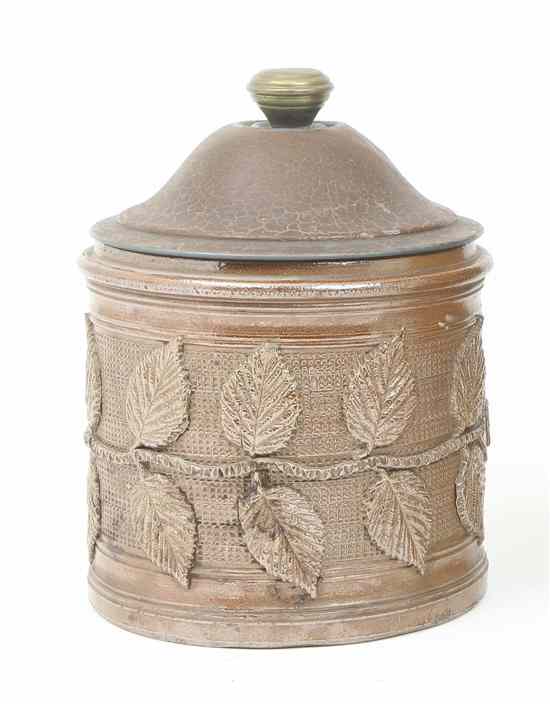 Appraisal: A Continental Ceramic Tobacco Jar having a tin lid over