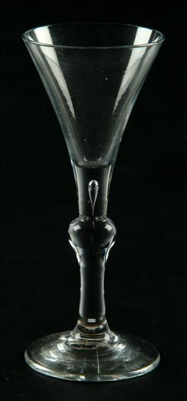 Appraisal: A balustroid wine glass the funnel bowl of drawn trumpet