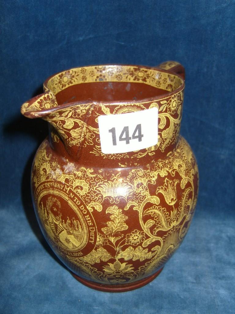 Appraisal: An early th century brown glazed jug with yellow printed