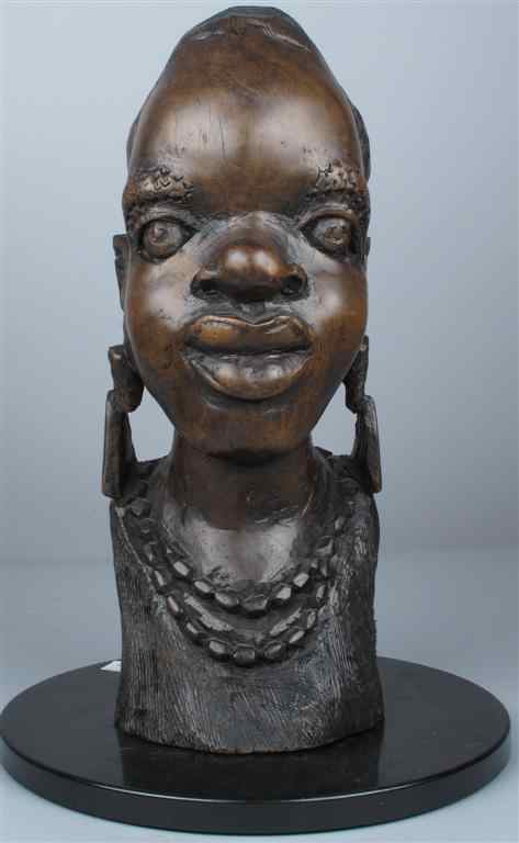 Appraisal: CARVED WOODEN BUST OF AN AFRICAN GIRL h in Provenance