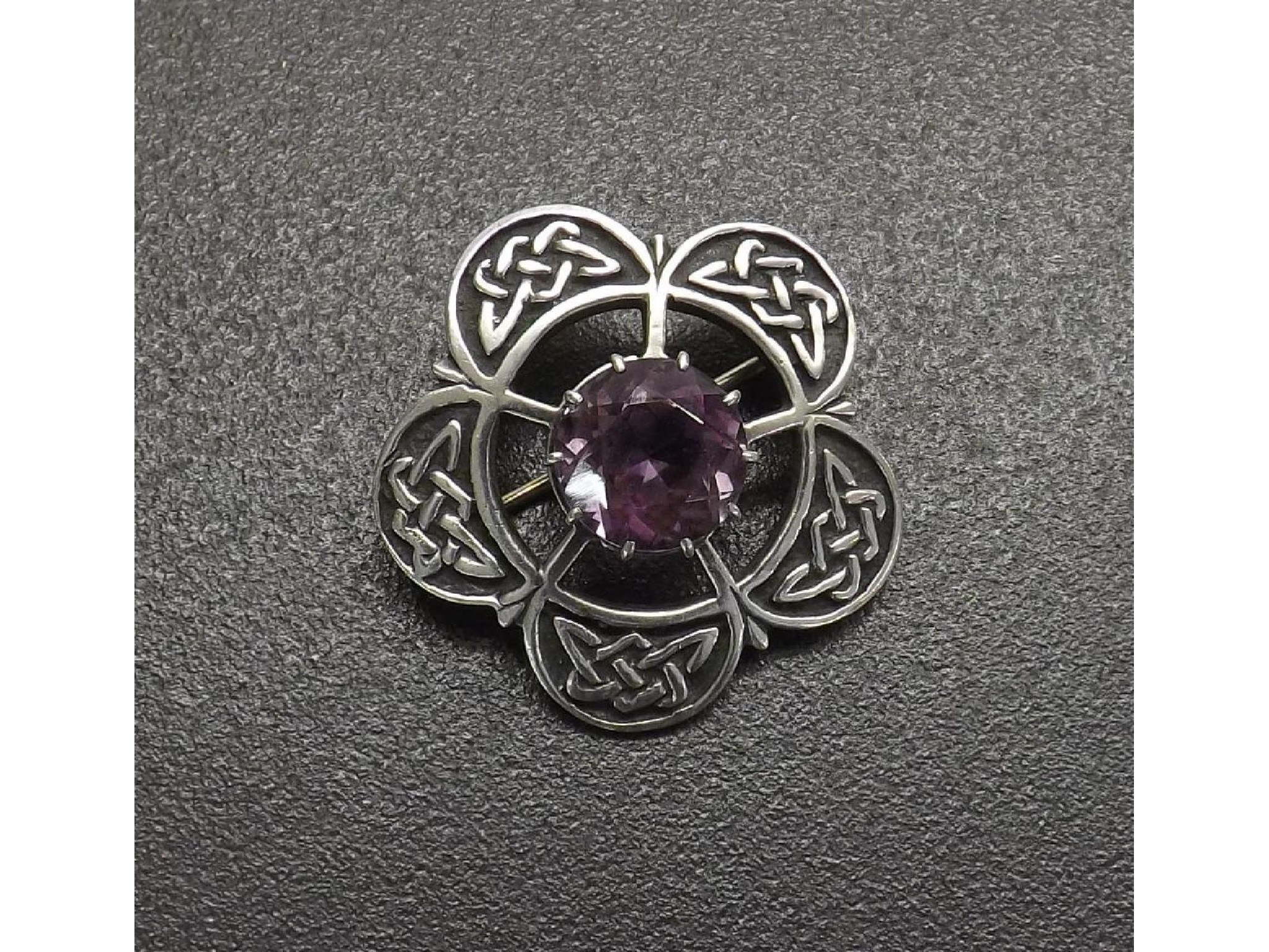 Appraisal: Iona Scottish silver brooch with a central faceted amethyst stamped