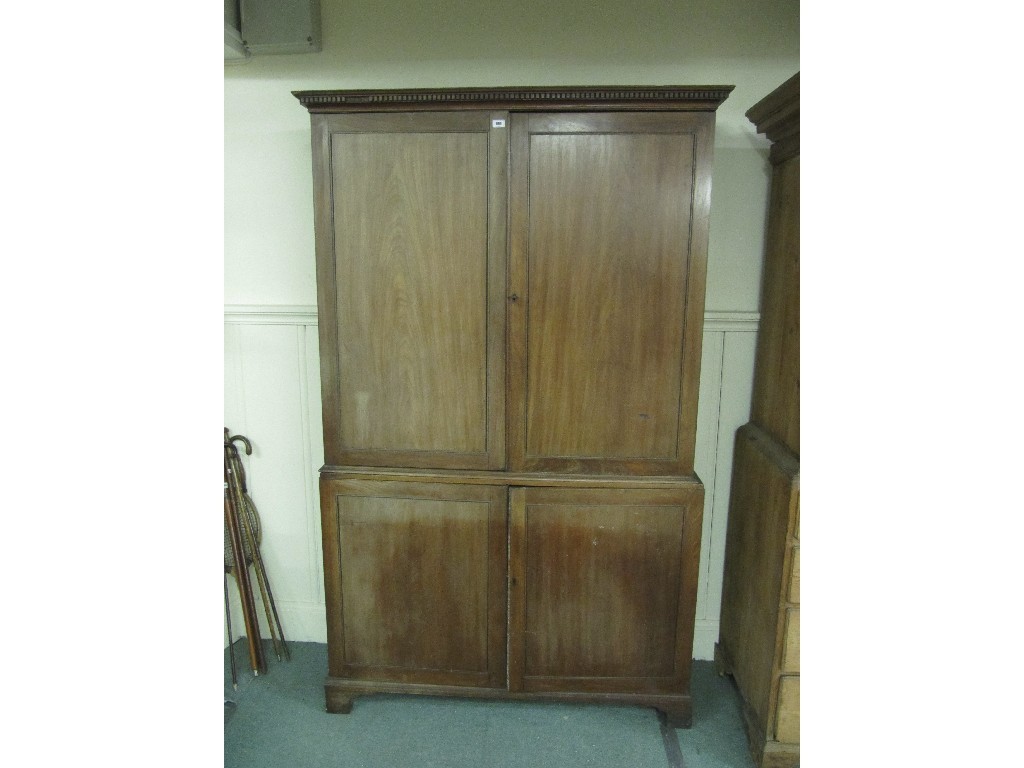 Appraisal: Early th Century mahogany bookcase on cupboard base