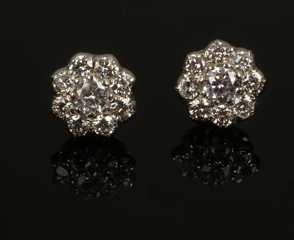 Appraisal: A pair of diamond earrings of cluster design set with