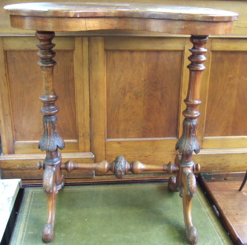 Appraisal: A Victorian walnut occasional table the kidney shaped top raised